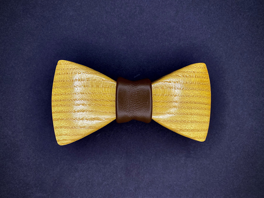 Mulberry wood bowtie with a dark brown leather middle wrap.