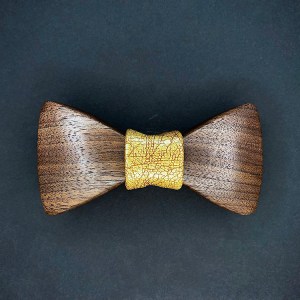 Walnut wood bowtie with a yellow textured leather middle wrap.