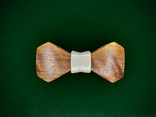 Walnut wood bowtie with a white leather middle wrap.
