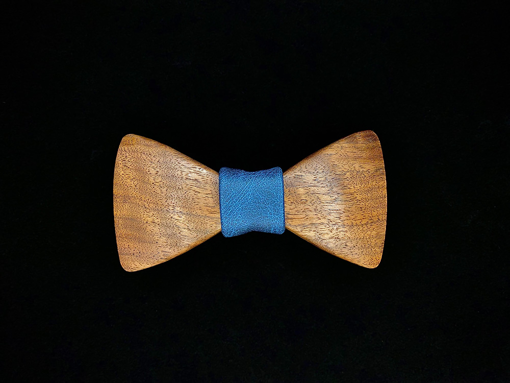 Walnut wooden bowtie with a blue leather middle wrap.